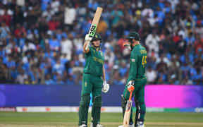 South Africa's David Miller (L) celebrates his fifty.