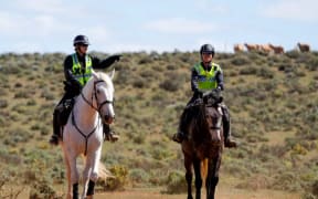 Mounted police officers assisted in the initial search for Gus in late September.