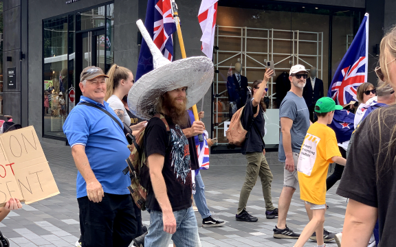A protester in a tinfoil hat at the anti-mandate demonstration in Christchurch.