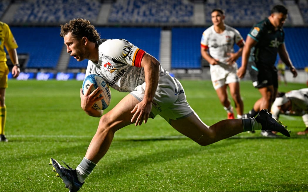 Liam Coombes-Fabling runs in to score a try which is later disallowed.