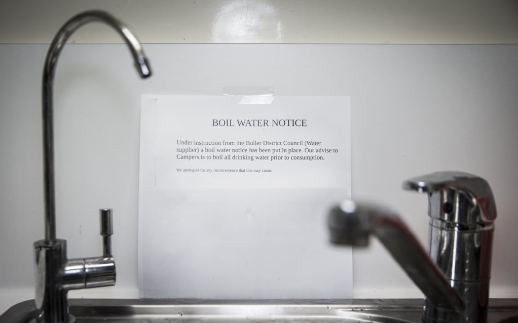 notice on wall behind a sink