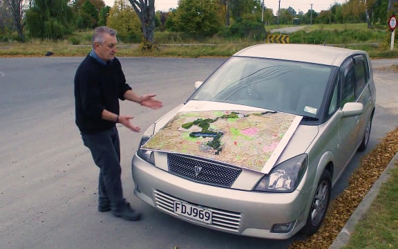 Evan Smith, from the Avon-Otakaro Network, with a map of the Red Zone.