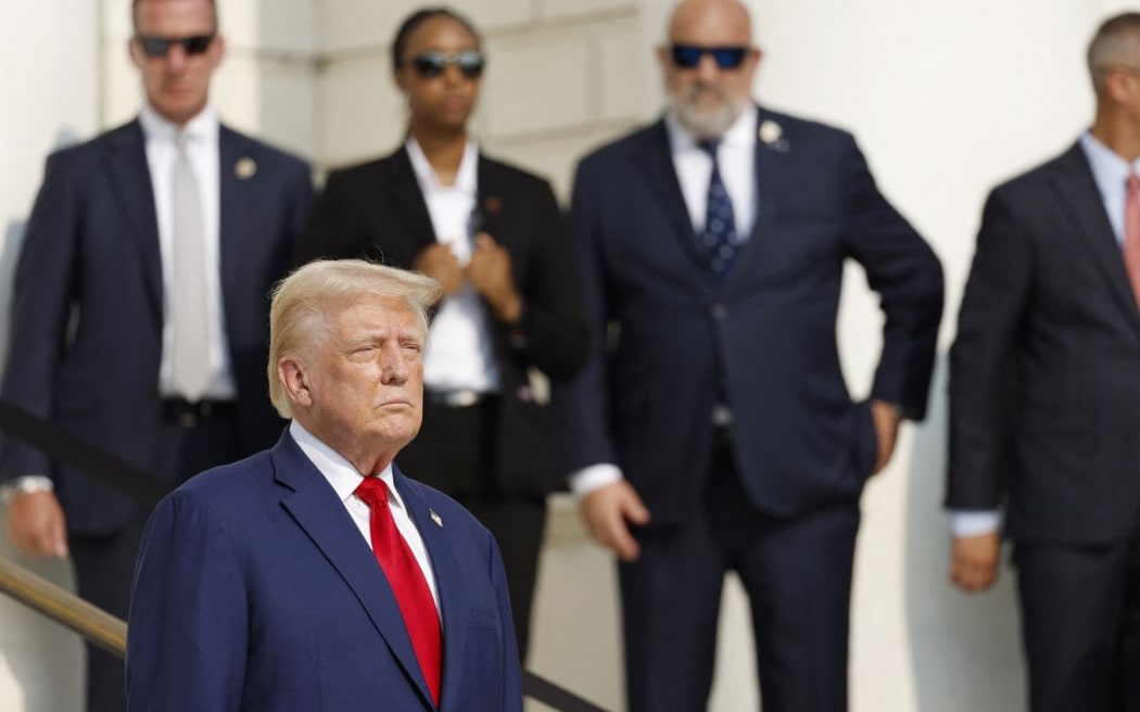 ARLINGTON, VIRGINIA - AUGUST 26: Republican presidential nominee, former U.S. President Donald Trump looks on during a wreath laying ceremony at the Tomb of the Unknown Soldier at Arlington National Cemetery on August 26, 2024 in Arlington, Virginia. Monday marks three years since the August 26, 2021, suicide bombing at Hamid Karzai International Airport, which killed 13 American service members.   Anna Moneymaker/Getty Images/AFP (Photo by Anna Moneymaker / GETTY IMAGES NORTH AMERICA / Getty Images via AFP)