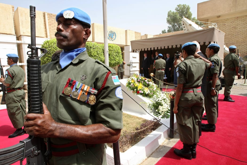 Members of the Fiji Islands UN peackeeping troops perform a guard honour at a memorial monument in the UN headquarters in Baghdad’s Green Zone on August 13, 2008.