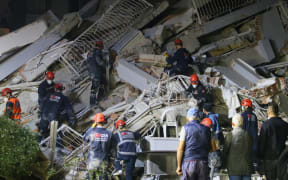 IZMIR, TURKEY - OCTOBER 30: Search and rescue works continue at debris of buildings after a magnitude 6.6 quake shook Turkey's Aegean Sea coast, in Izmir, Turkey on October 30, 2020.
