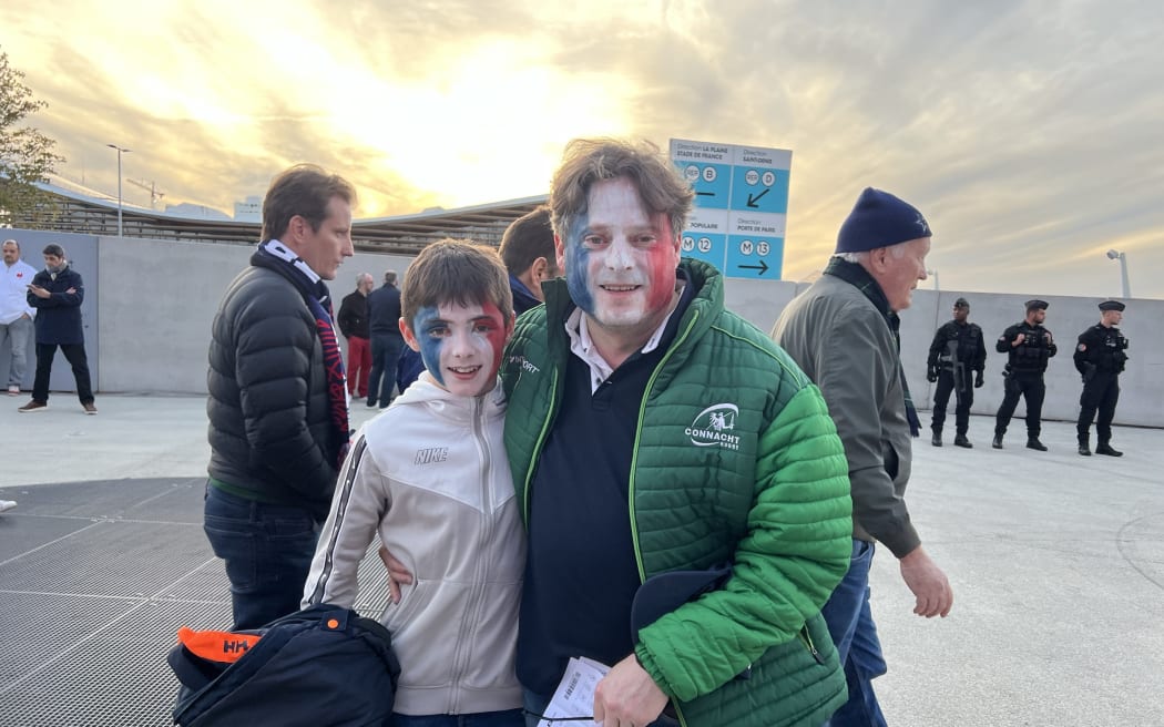 Ireland fans Jonathan Egan and his son Ted are supporting their second favourite team France.