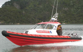 A Coastguard Whangaroa boat in the water.