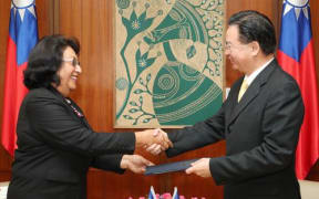 Marshall islands’ new ambassador to Taiwan, Neijon Rema Edwards, left, presents her credentials to Foreign Minister, Joseph Wu, in Taipei.