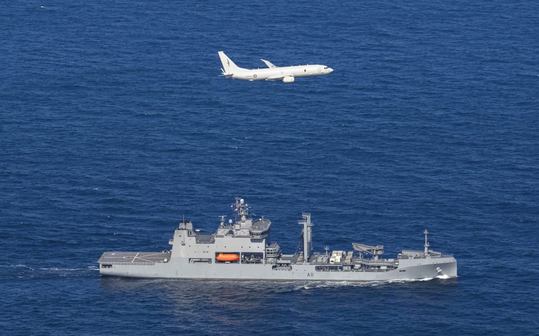 A Royal New Zealand Air Force Poseidon P8-A, works in partnership with HMNZS Aotearoa during Op Whio.