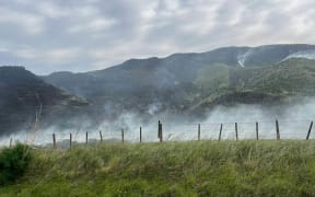 fire crews work to try and contain a huge bush fire near Porangahau.