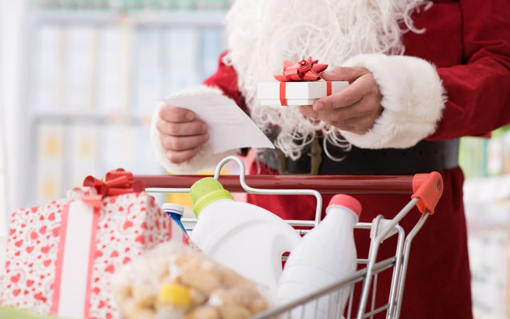Santa Claus doing grocery shopping at the supermarket,