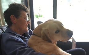 Edie with her assistance dog Melvin.