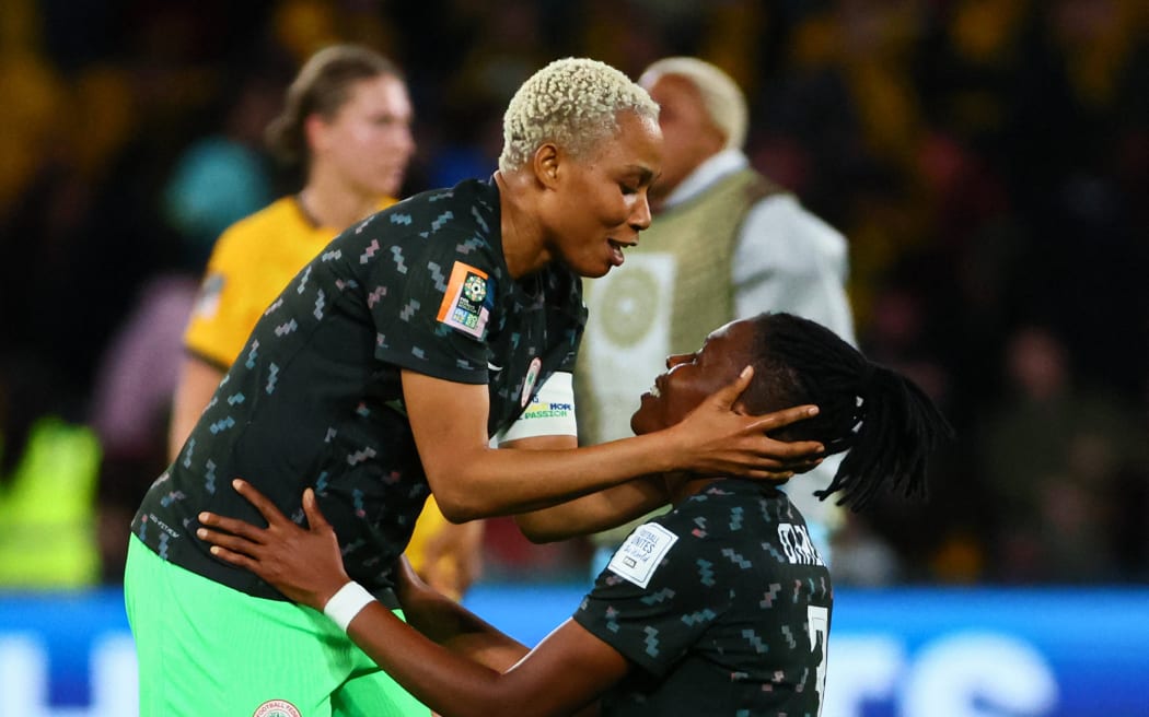 Nigeria defenders Onome Ebi and Osinachi Ohale celebrate their team's victory over Australia at the Women's World Cup in Brisbane.