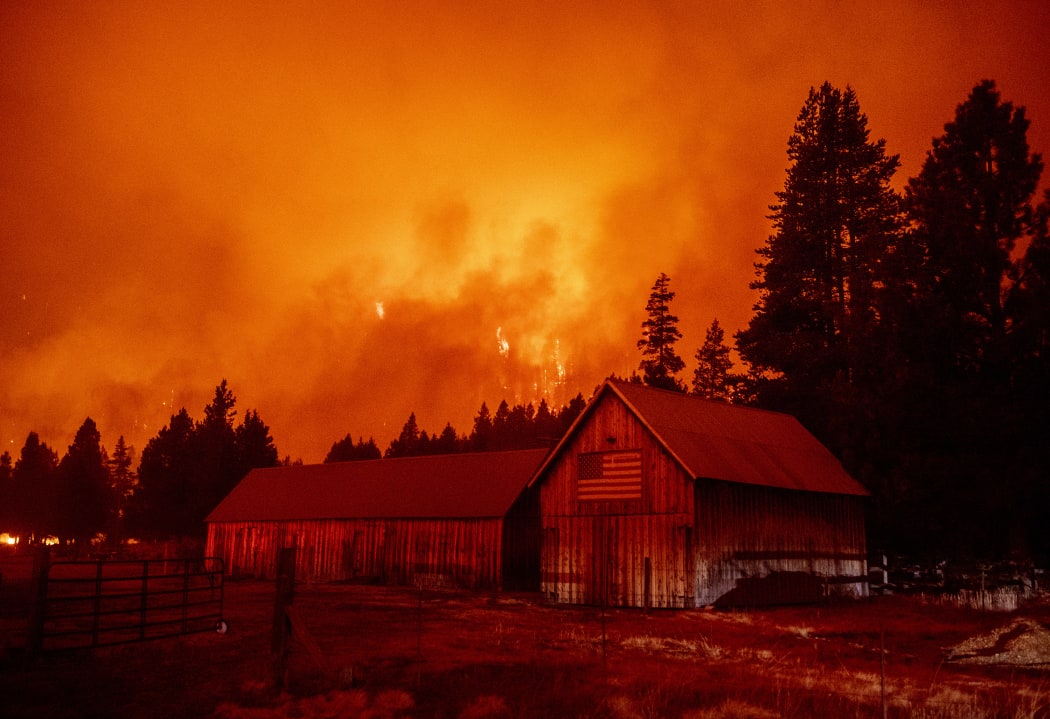 Flames consume multiple homes as the Caldor fire pushes into the Echo Summit area, California on August 30, 2021.