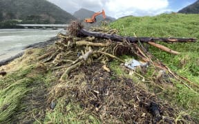 A surging tide ate into land beside the Awatere River mouth, exposing layers of rubbish and dragging them out to sea earlier this week