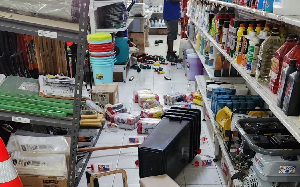 Santo Hardware workers clean up following magnitude-7 earthquake.