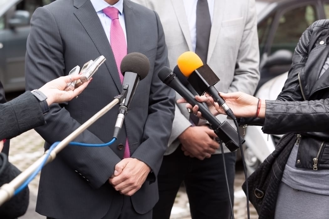 Journalists making media interview with businessperson or politician