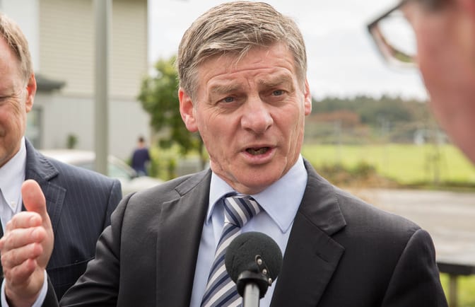 Bill English at a social housing announcement in Northcote
