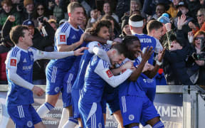 Macclesfield's English striker #07 Isaac Buckley-Ricketts (R) celebrates with teammates after scoring the team's second goal during the English FA Cup third round football match between Macclesfield Town and Crystal Palace at Leasing.com Stadium, Moss Rose in Macclesfield, northern England on January 10, 2026. (Photo by Darren Staples / AFP) / RESTRICTED TO EDITORIAL USE. NO USE WITH UNAUTHORIZED AUDIO, VIDEO, DATA, FIXTURE LISTS, CLUB/LEAGUE LOGOS OR 'LIVE' SERVICES. ONLINE IN-MATCH USE LIMITED TO 120 IMAGES. AN ADDITIONAL 40 IMAGES MAY BE USED IN EXTRA TIME. NO VIDEO EMULATION. SOCIAL MEDIA IN-MATCH USE LIMITED TO 120 IMAGES. AN ADDITIONAL 40 IMAGES MAY BE USED IN EXTRA TIME. NO USE IN BETTING PUBLICATIONS, GAMES OR SINGLE CLUB/LEAGUE/PLAYER PUBLICATIONS. /