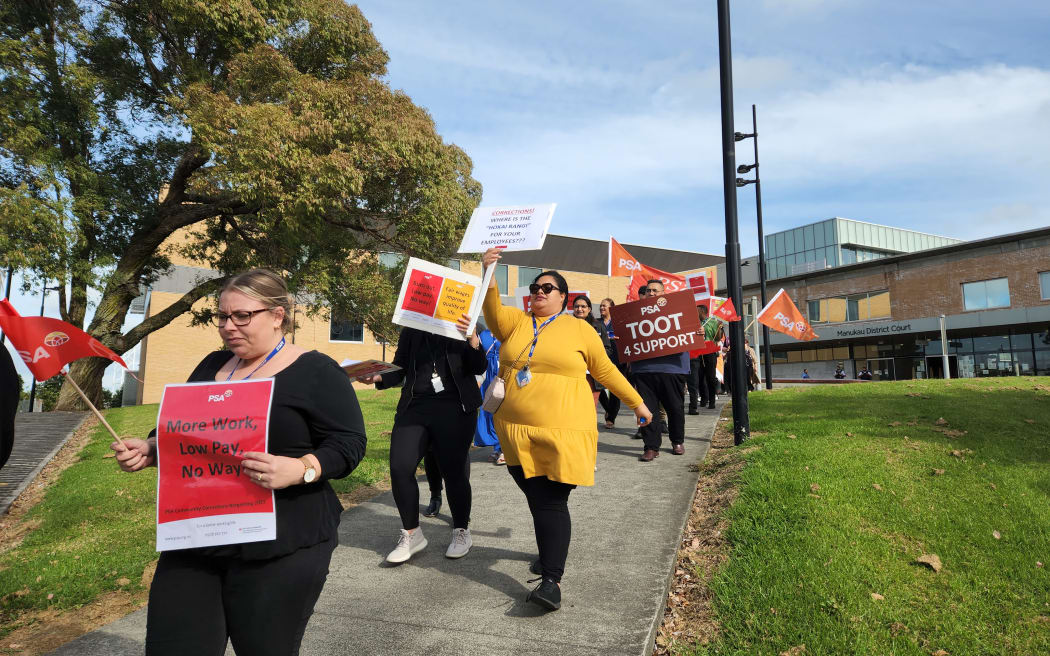 About fifty Community Corrections workers demonstrating outside the Manukau District Court in Auckland.