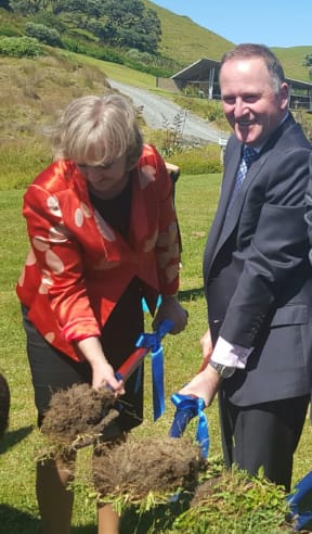 Prime Minister John Key and Communications Minister Amy Adams turn the first sod for construction of the undersea cable in Northland.