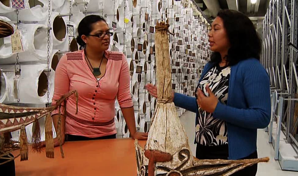 Togialelei Dr Safua Akeli Amaama (R) talking with Te Papa colleague in collections storage.