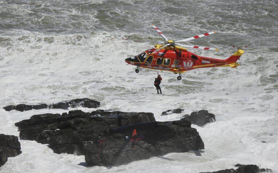 Two fishermen were rescued after facing large swells and becoming trapped on rocks at Sunset Beach on 29 January, 2024.