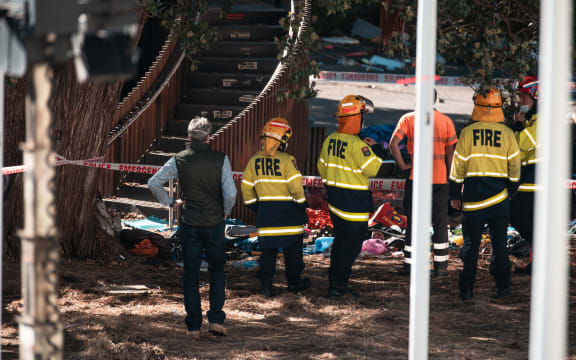 Fire crews assessing the damage after the slide at Parliament grounds was lit on fire on 3 March.