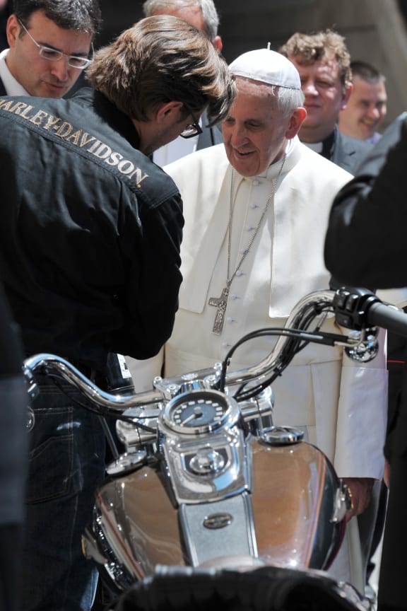 Pope Francis looks at a Harley Davidson motorcycle in Saint Peter's Square last June.