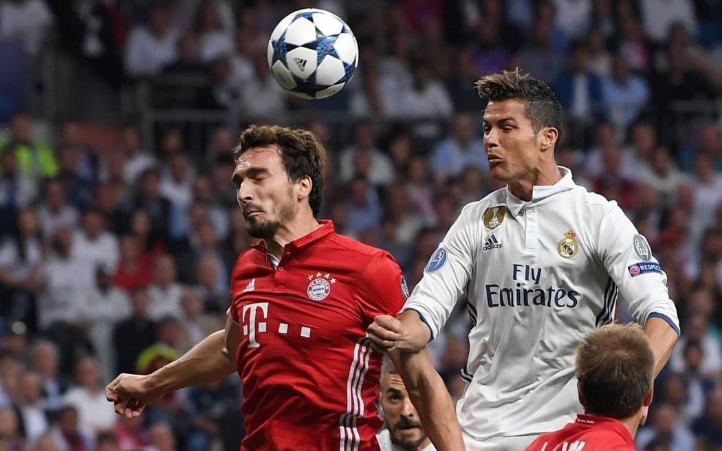 Cristiano Ronaldo (right) gets high against Bayern Munich.