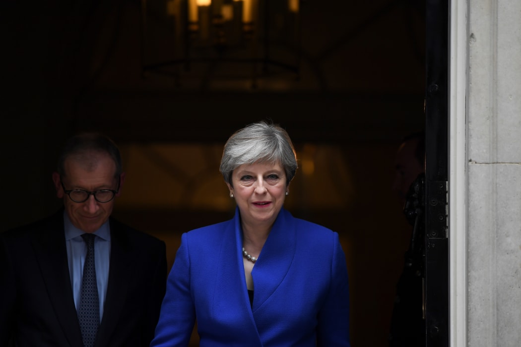 Theresa May leaves 10 Downing Street, en route to Buckingham Palace to meet the Queen the day after the general election.