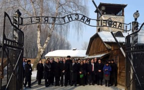Members of the Knesset enter the main gate at the Auschwitz concententration camp in Poland on Holocaust Day.