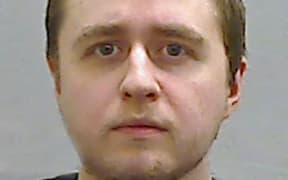 This undated handout custody photograph released by Police Service of Northern Ireland (PSNI) on October 25, 2024, shows Alexander McCartney, who admitted 185 charges involving 70 children, posed as a teenage girl to befriend young females across the world on Snapchat before blackmailing them. - A prolific "catfish" offender who pushed one of his victims, a 12-year-old US girl, to commit suicide was on Friday jailed for life at a court in Northern Ireland. (Photo by PSNI / AFP) / RESTRICTED TO EDITORIAL USE - MANDATORY CREDIT "AFP PHOTO / PSNI " - NO MARKETING NO ADVERTISING CAMPAIGNS - DISTRIBUTED AS A SERVICE TO CLIENTS