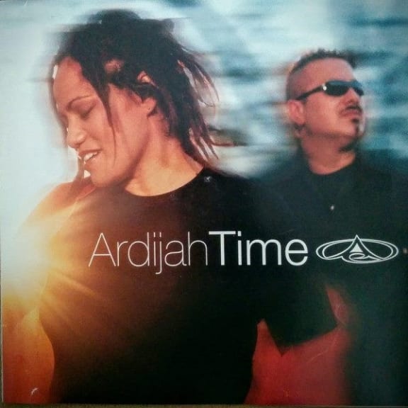 Cover image of Ardijah's album Time. Photo of two people in motion, outdoors.