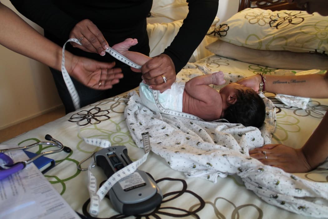 Rizwanna measures baby Jamaica