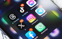 Moscow, Russia, 29-07-2023: New Elon Musk’s twitter X app on smartphone screen surrounded by other social media network apps. Twitter rebranding. Modern social media communication.