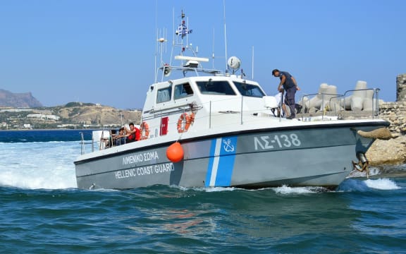 A Greek Coastguard boat carrying migrants arrives in port in Crete last July.