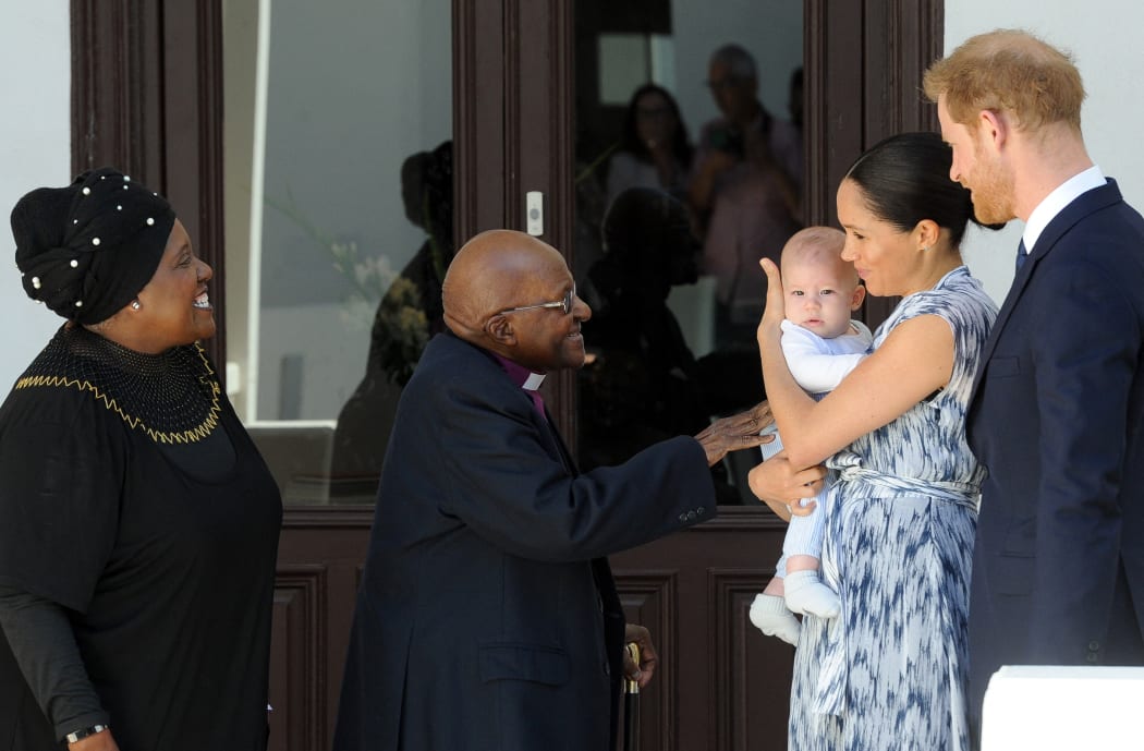 Britain's Duke and Duchess of Sussex, Prince Harry and his wife Meghan hold their baby son Archie as they meet with Archbishop Desmond Tutu and his wife Leah at the Tutu Legacy Foundation in Cape Town on September 25, 2019.