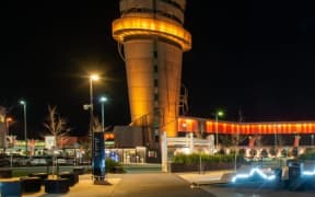 Christchurch Airport's tower and terminal was lit in orange in honour of Sounds Air final flight over the weekend.