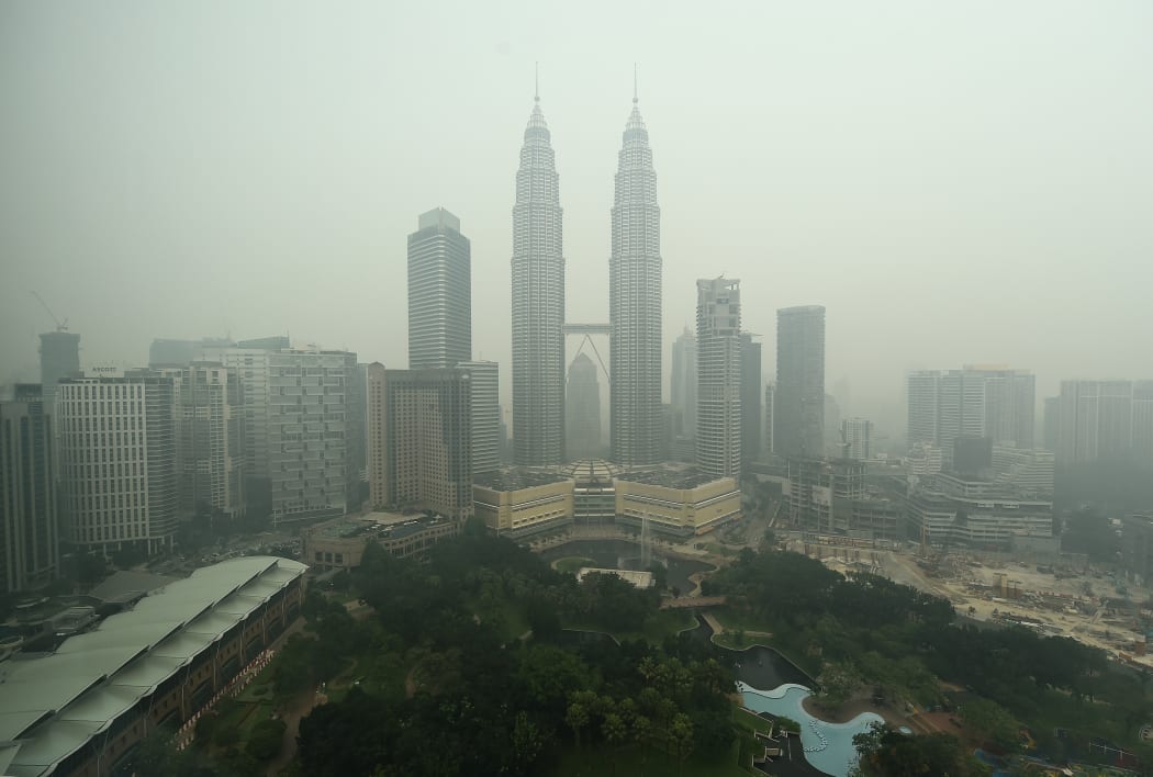 Malaysia's iconic Petronas twin towers and Kuala Lumpur's skyline are shrouded in thick haze.