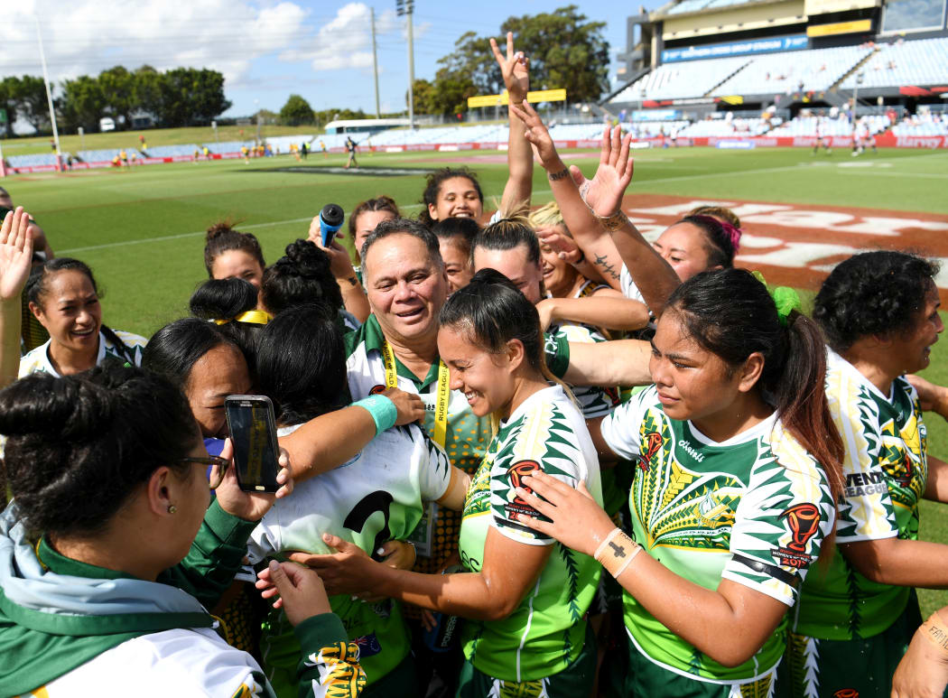 Cook Islands players celebrate beating England.
