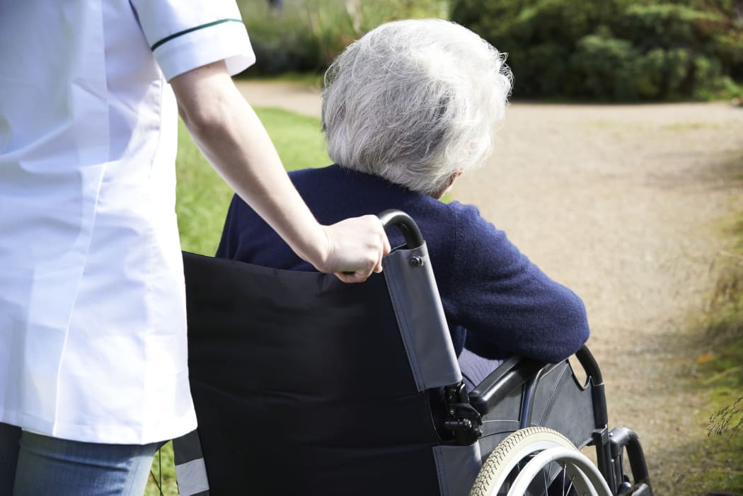 Senior woman in wheelchair.