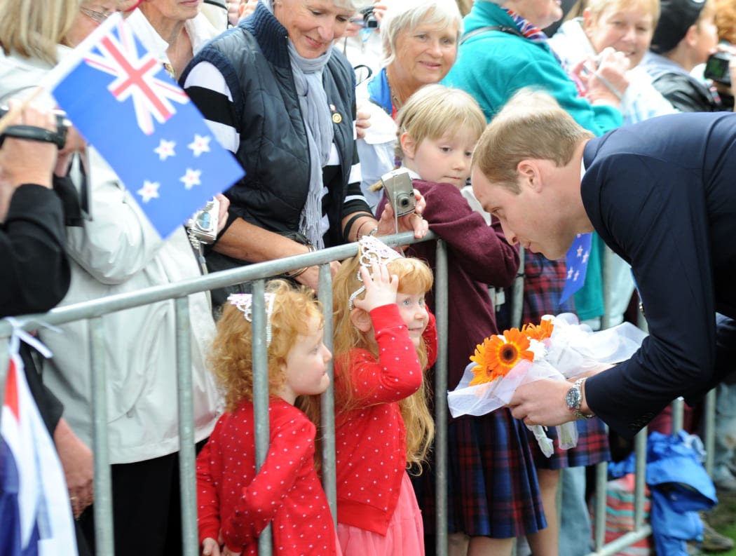 The Duke of Cambridge receives a gift from a young fan.