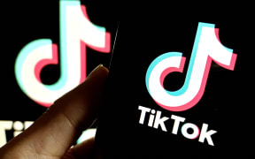 An illustration is being shown in Suqian, China, on January 24, 2024, depicting TikTok's layoffs in the United States. (Photo by Costfoto/NurPhoto) (Photo by CFOTO / NurPhoto / NurPhoto via AFP)
