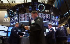 Traders work on the floor of the New York Stock Exchange