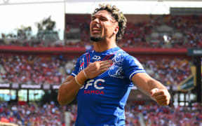 Izack Tago of Samoa celebrates his try, Tonga XIII v To a Samoa, round 2 of the Pacific Championship rugby league match at Suncorp Stadium, Brisbane.