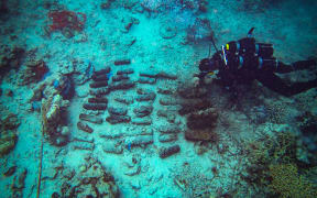 A Navy diver recovers unexploded ordnance in Solomons Islands.