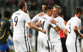 All Whites player Ryan Thomas celebrates his goal with team mates.