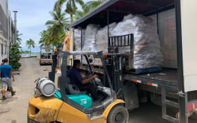 In Suva, emergency supplies bound for the Lau Group in Fiji are prepped and loaded for transport. 2022