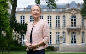 (FILES) French Prime minister Elisabeth Borne poses in the garden of the Hôtel de Matignon, the official residence of the Prime Minister of France, on May 31, 2022 in Paris. French Prime Minister Elisabeth Borne has tendered her resignation from the government, French President Emmanuel Macron has accepted it, announced the presidency on January 8, 2024. (Photo by JOEL SAGET / AFP)